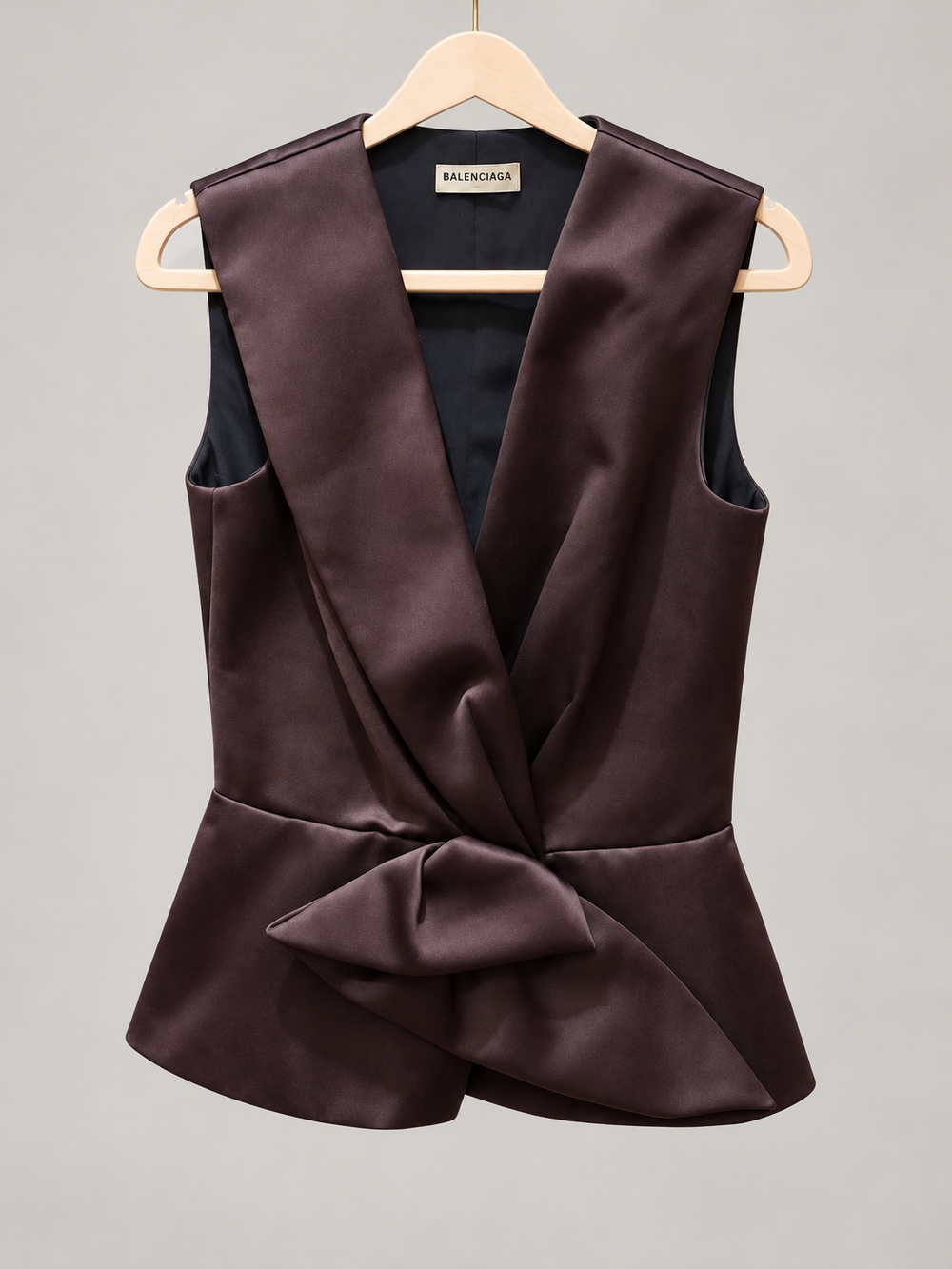 Balenciaga draped peplum top styled with a black midi skirt and minimal heeled sandals