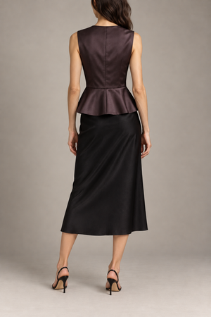 Balenciaga peplum top styled back view with black midi skirt