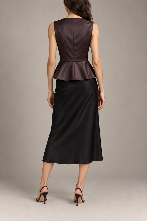 Balenciaga peplum top styled back view with black midi skirt