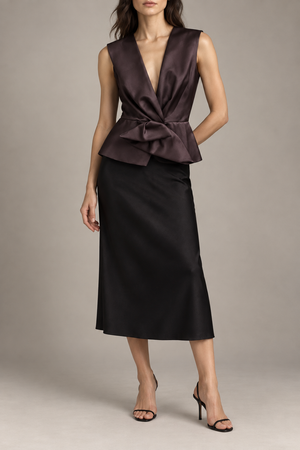 Balenciaga draped peplum top styled with a black midi skirt and minimal heeled sandals