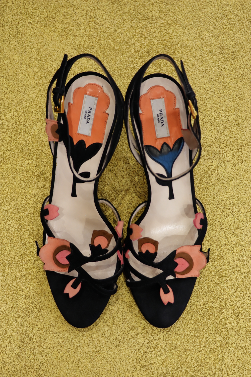 Prada Tulip Strap Sandals on original yellow textured background