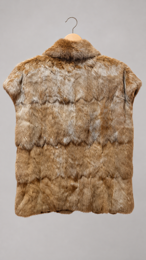 Rabbit fur vest on hanger, back view