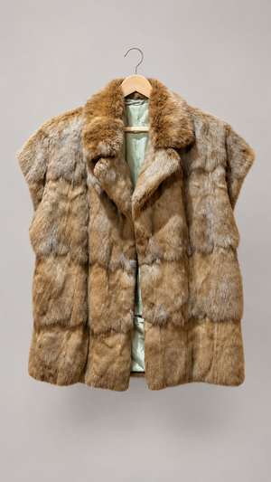 Rabbit fur vest on hanger, front view